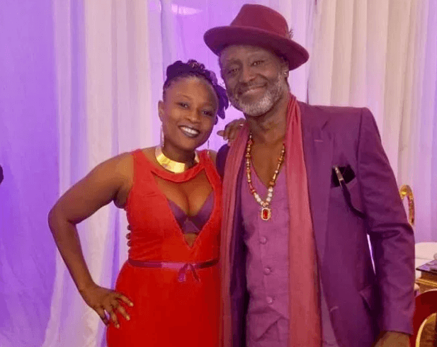 Reggie Rockstone with wife at Sarkodie and Tracy's white wedding held at Labadi Beach Hotel in Accra on Saturday, July 21
