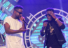 Sarkodie (white) and Shatta Wale perform together at a show