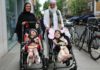 Safa and Marwa Ullah leave hospital with their mother and their grandfather. Photograph: Great Ormond Street Hospital/PA