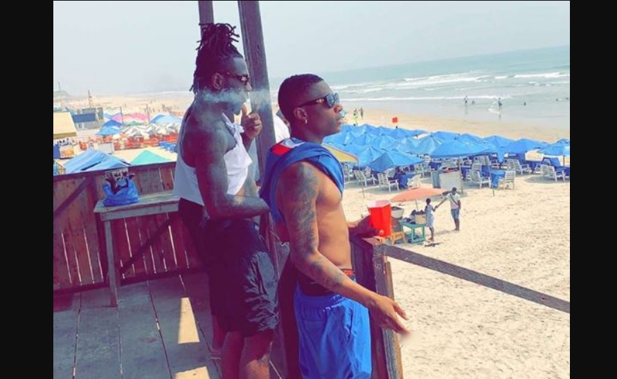 Nigerian musicians, Burna Boy and Wizkid chilling at Accra's Labadi Beach