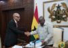 President Akufo-Addo receiving the report from Justice Emile Short