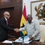 President Akufo-Addo receiving the report from Justice Emile Short