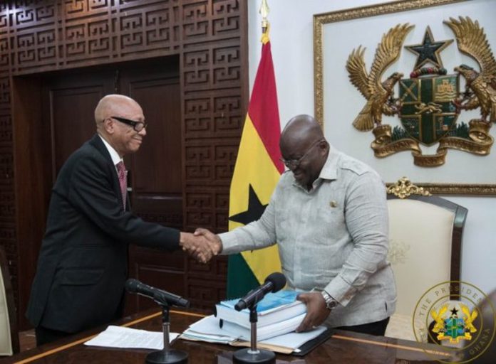 President Akufo-Addo receiving the report from Justice Emile Short