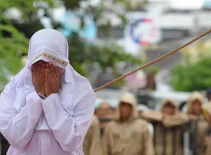 Couples caned for having sex outside marriage [Photos] 52