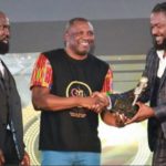 Samini receiving his award