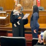 Judge holds baby as mom is sworn in as lawyer