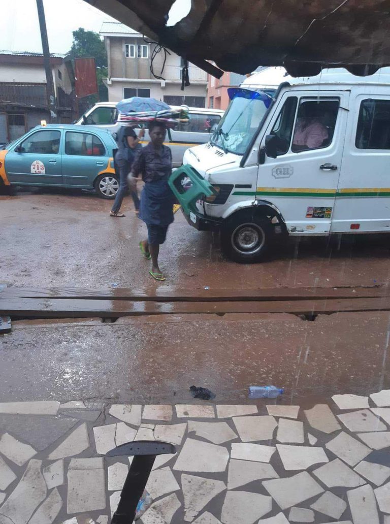 Photo: Woman who sells umbrella severely beaten by rain