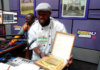 Enoch Kwesi Worlanyo displaying his award