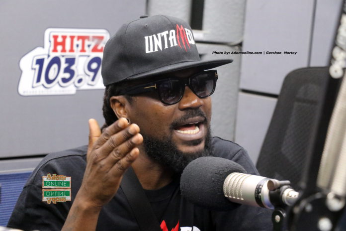 Samini wears Untamed T-shiirt on Daybreak Hitz