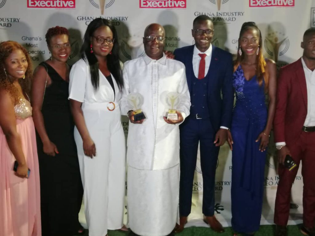 Holy Trinity Medical Center CEO, Dr Felix Anyah surrounded by some staff and friends