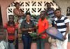 Rachel Appoh handing over the items to the leadership of Gomoa Youth in Agric