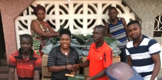 Rachel Appoh handing over the items to the leadership of Gomoa Youth in Agric