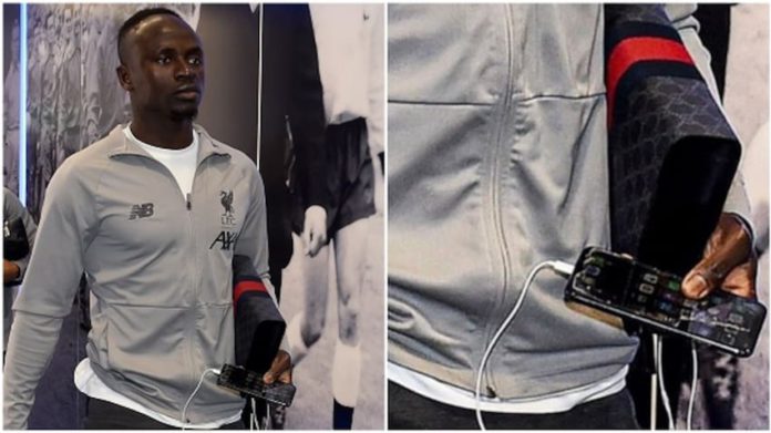 For a player, who according to The Guardian, earns £150,000 per week in the Premier League, it is extremely strange to see him carrying around an iPhone with a broken screen guard.
