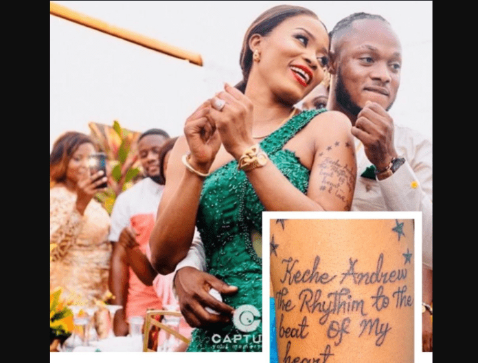 Keche Andrew's wife tattoos singer's name on her hand
