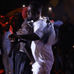 Sarkodie hugs Bosom Pyung at a concert in Ghana in 2019