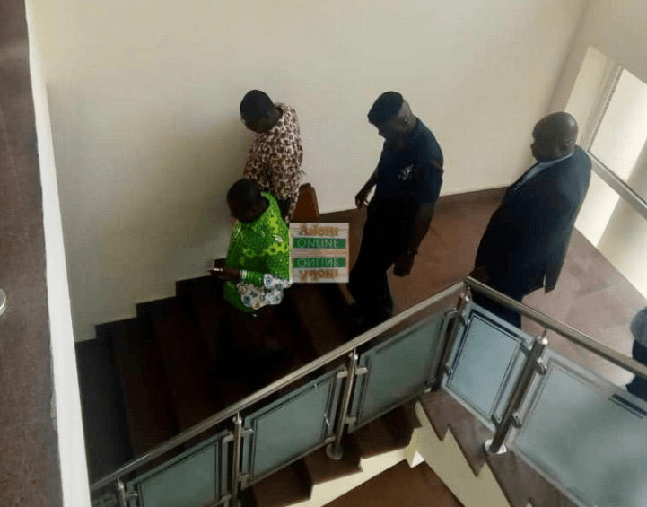 Forrmer District Finance Officer for sefwi Akontombra assembly Isaac Akowuah and the Current Officer James Esilfie in handcuffs being taken away by the police