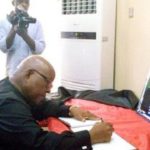 Speaker, Leadership of Parliament console Deputy Minority Leader The Speaker, Reverend Professor Mike Oquaye signing the book of condolence