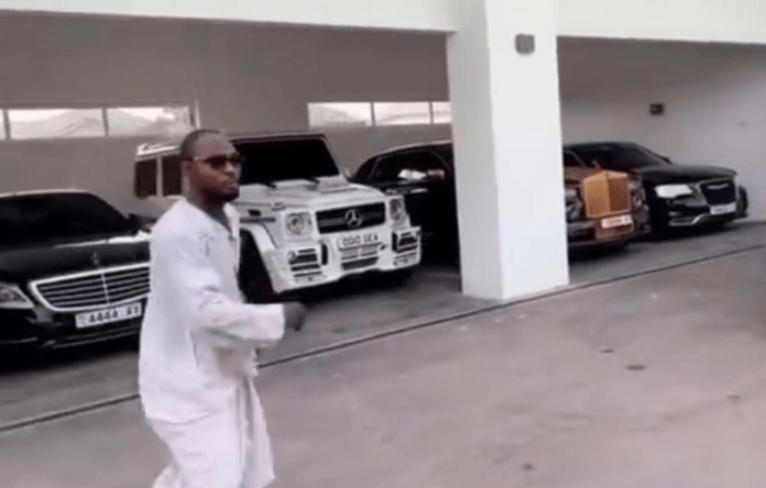 Funny Face choosing a car of his choice at Adebayor's home