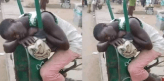 Man sleeping on a wheelbarrow