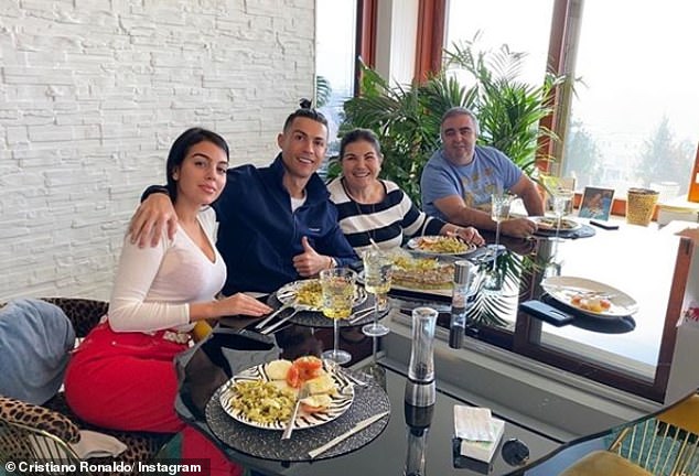 25874154 8103695 Ronaldo pictured here with partner Georgina Rodriguez left and h a 4 1584010302886
