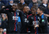 Jordan Ayew celebrates with Palace teammates