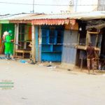 Boy watches on unprotected in market disinfection exercise