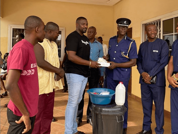 John Dumelo has donated detergents, soaps, gloves and other items to five police stations