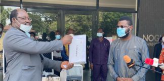 Director of Noguchi, Professor Abraham kwabena Annang accepting the donation and posing with Gregory Rockson, CEO of Pharma.