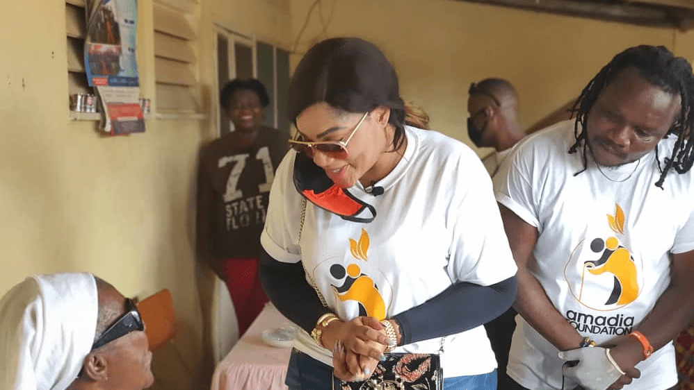 CEO of Amadia Foundation, Mrs Nana Ama Duodo conversing with an elder person in Tema