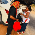 Edem shares money to fans; feeds police, military