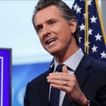 Governor Gavin Newsom discusses an outline for what it will take to lift coronavirus restrictions during a news conference at the Governor''s Office of Emergency Services in Rancho Cordova [File: Rich Pedroncelli/AP Photo]