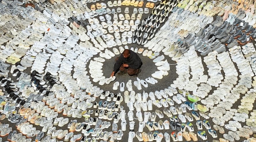 Kanye West surrounded by hundreds of Yeezys