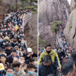 Visitors pack Anhui province's Huangshan mountain park on April 4, exceeding the visitor limit of 20,000.