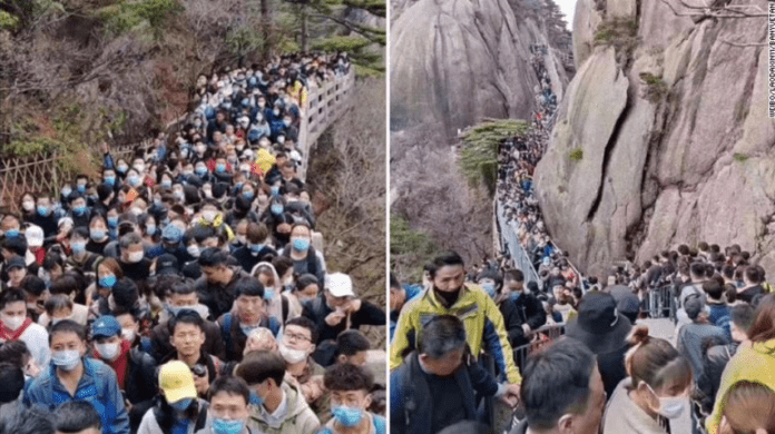 Visitors pack Anhui province's Huangshan mountain park on April 4, exceeding the visitor limit of 20,000.