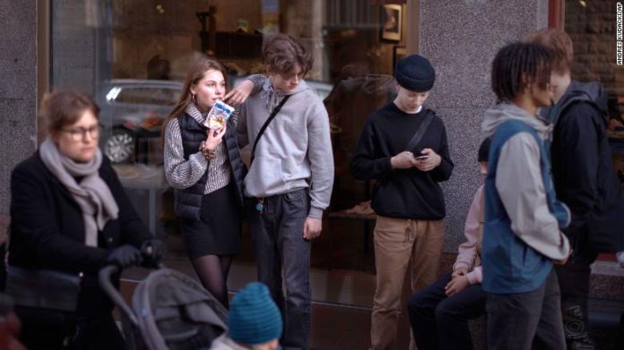 People hang out in the street in Stockholm, Sweden, Wednesday, April 8, 2020. Swedish authorities have advised the public to practice social distancing because of the coronavirus pandemic, but still allow a large amount of personal freedom, unlike most other European countries. The new coronavirus causes mild or moderate symptoms for most people, but for some, especially older adults and people with existing health problems, it can cause more severe illness or death.(AP Photo/Andres Kudacki)