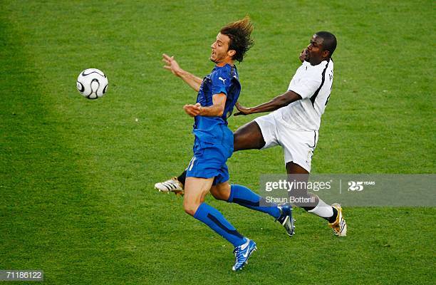 HANOVER, GERMANY - JUNE 12: Samuel Kuffour of Ghana thwarts the progress of Alberto Gilardino of Italy during the FIFA World Cup Germany 2006 Group E match between Italy and Ghana played at the Stadium Hanover on June 12, 2006 in Hanover, Germany. (Photo by Shaun Botterill/Getty Images)