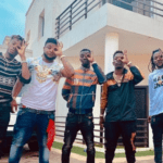 Shatta Wale and his Shatta Movement militants pose in front of his mansion at East Legon