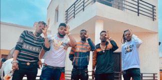 Shatta Wale and his Shatta Movement militants pose in front of his mansion at East Legon