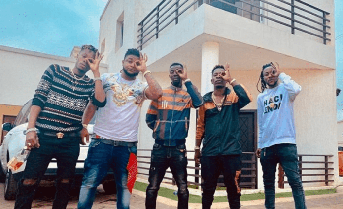 Shatta Wale and his Shatta Movement militants pose in front of his mansion at East Legon