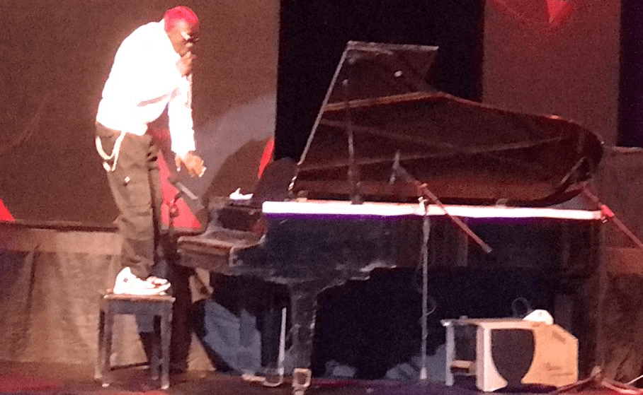 Meanwhile, Bosom got overwhelmed to the extent of mounting the seat of the piano centered for the music event.