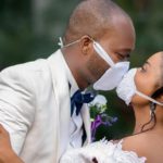 A touching photo of how two newlyweds shared their first kiss through face masks coronavirus wedding