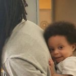 Sierra Leone 'role model' minister carries baby and holds Zoom meeting