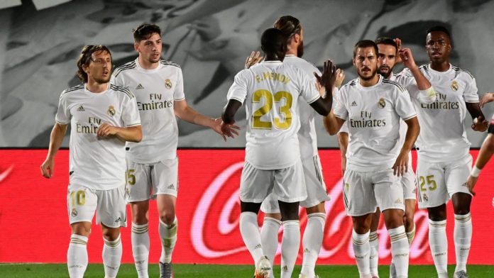 Real Madrid's Brazilian forward Vinicius Junior (R) celebtrates with teammates after scoring during the Spanish League football match Real Madrid CF against RCD Mallorca at at the Alfredo di Stefano stadium Image credit: Getty Images