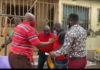 The NDC pastor (in red shirt ) was picked up at his house on Tuesday during a radio interview