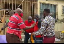 The NDC pastor (in red shirt ) was picked up at his house on Tuesday during a radio interview