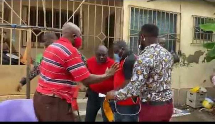 The NDC pastor (in red shirt ) was picked up at his house on Tuesday during a radio interview