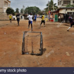 Children play football in Adabraka in Accra Ghana