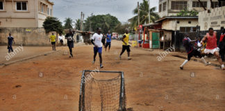 Children play football in Adabraka in Accra Ghana