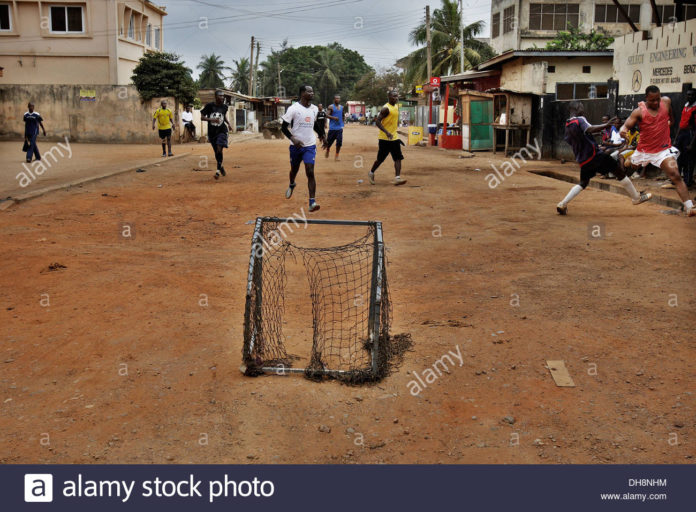 Children play football in Adabraka in Accra Ghana
