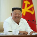 Kim Jong-un all smiles and social distancing weeks after mysteriously vanishing Kim Jong-un